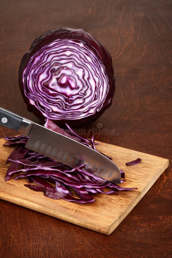 closeup-slicing-red-cabbage-kitchen-knife-slicing-red-cabbage-kitchen-knife-114475300.jpg