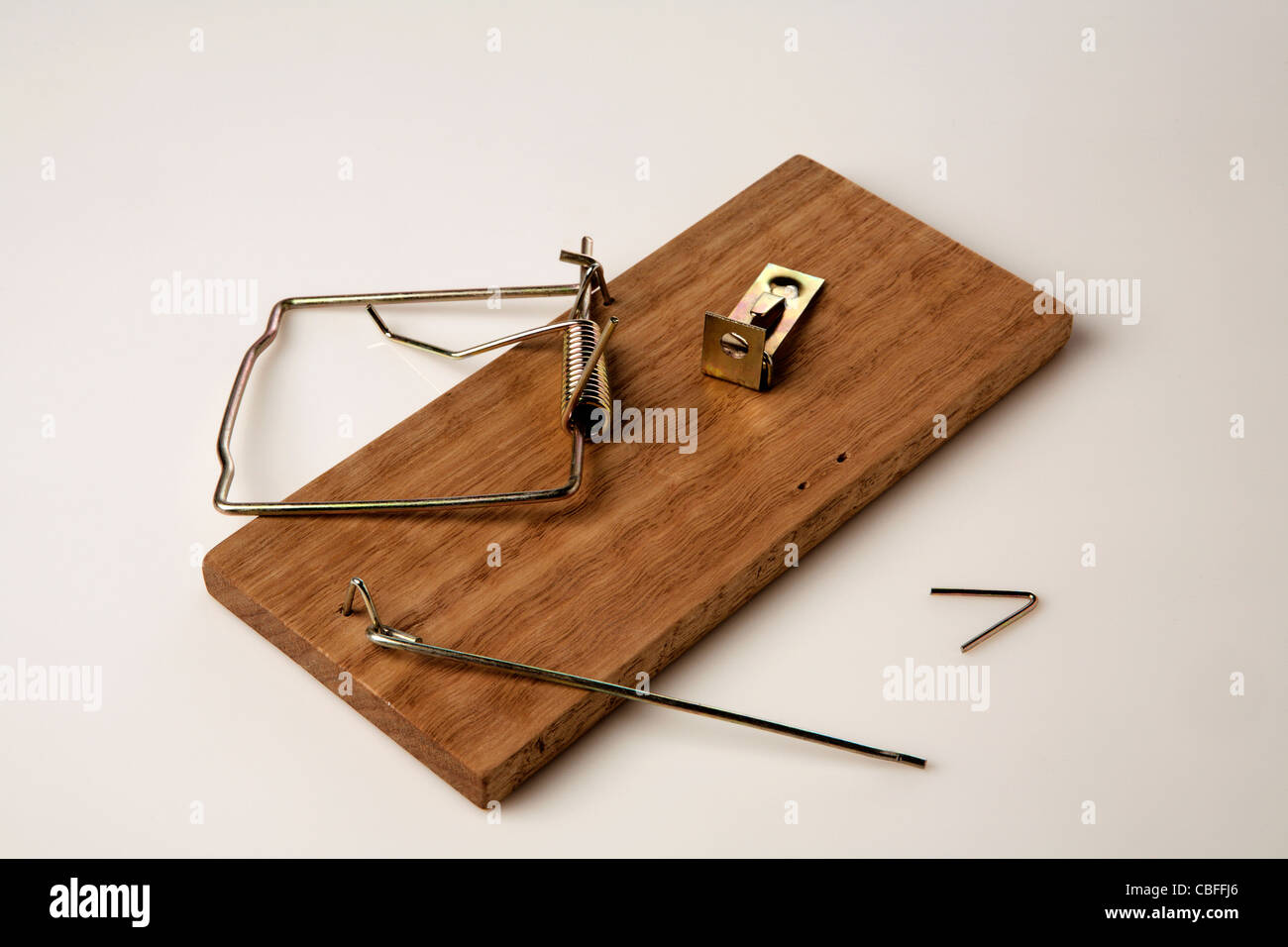 broken-mouse-trap-on-white-background-CBFFJ6.jpg