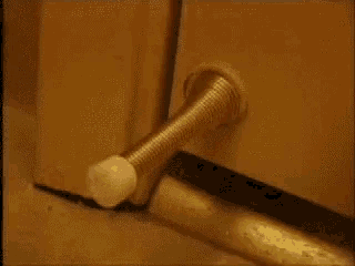 a hair dryer sitting on the floor next to a door