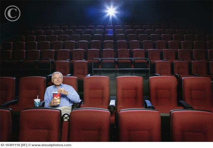 Man_Watching_a_Movie_in_an_Empty_Theatre_42-16491118.jpg