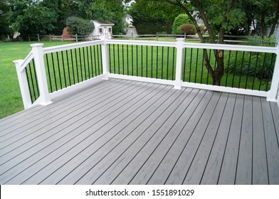 residential-backyard-gray-composite-deck-260nw-1551891029.jpg