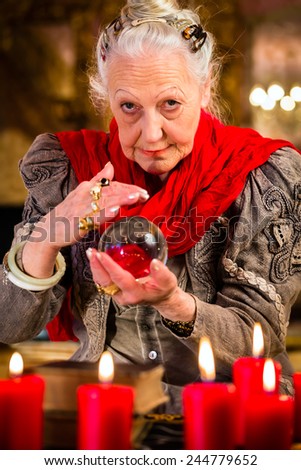 stock-photo-female-fortuneteller-or-esoteric-oracle-sees-in-the-future-by-looking-into-their-crystal-ball-244779652.jpg